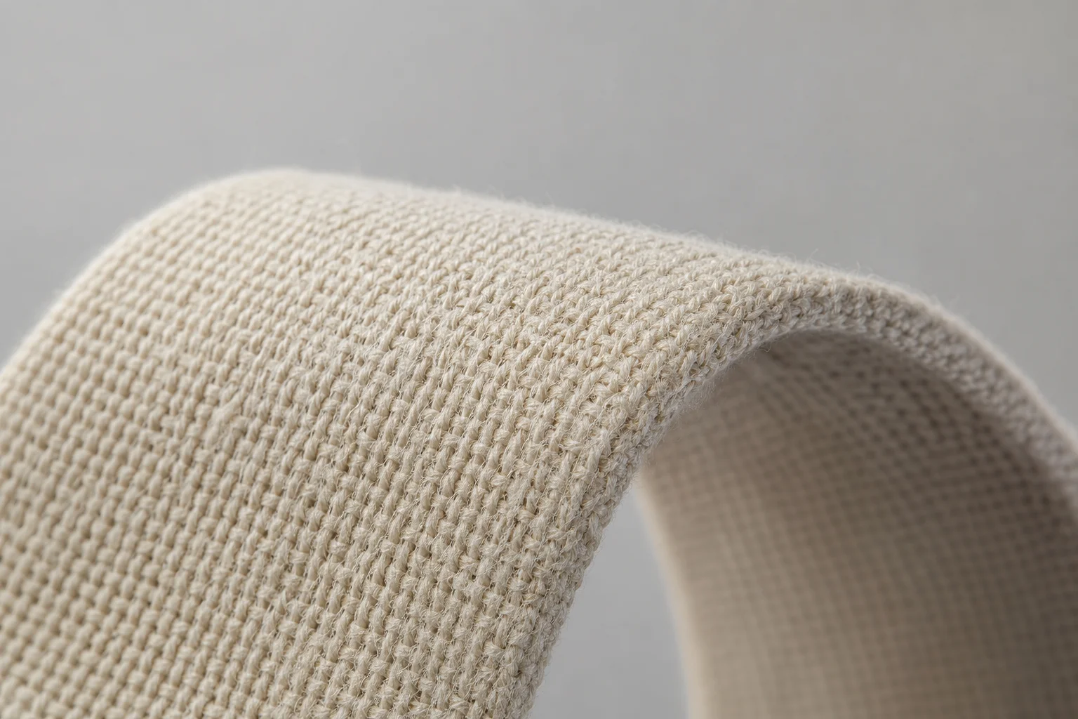 Close-up detail of fabric resistance band material showing cotton-latex blend