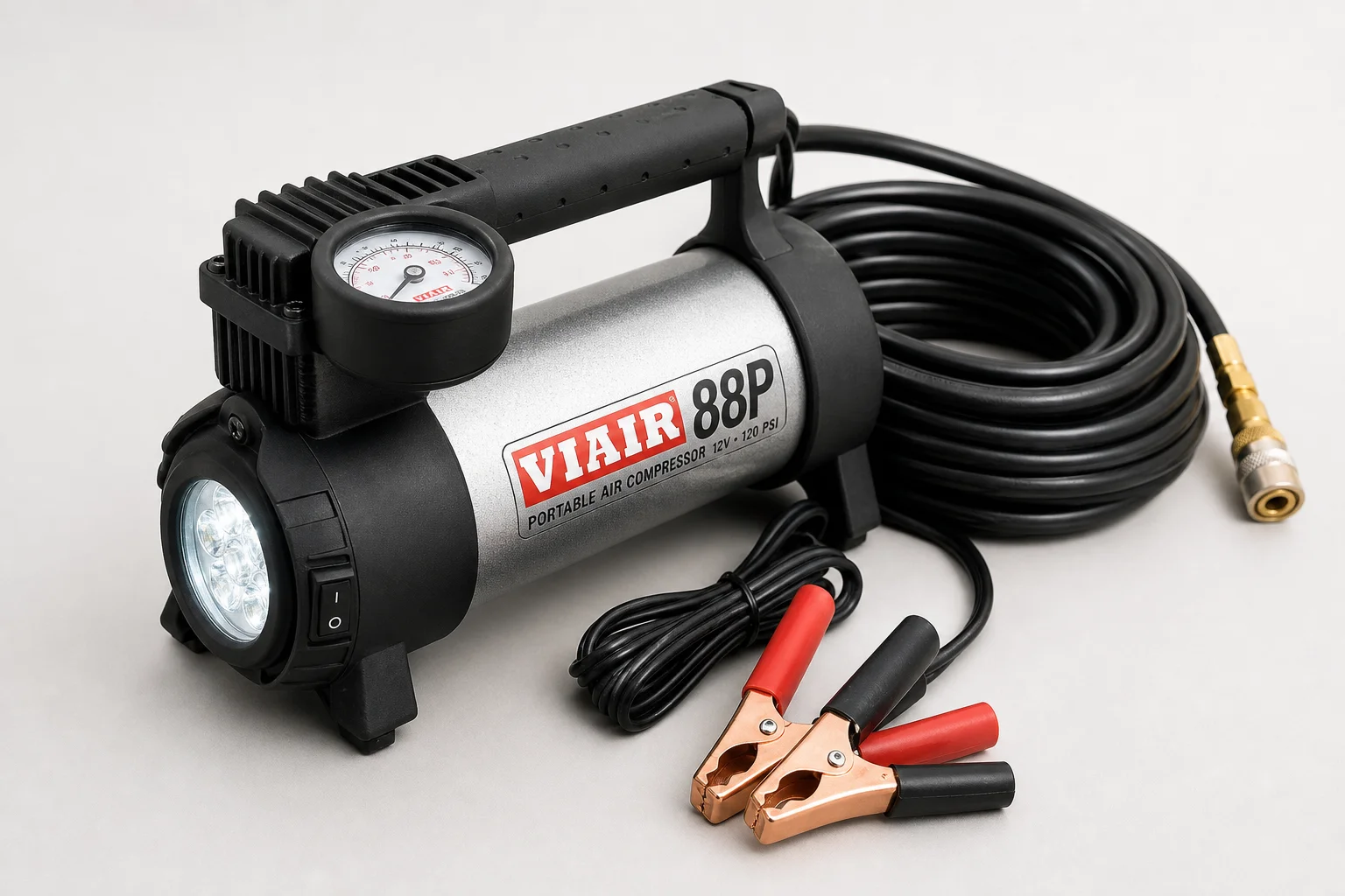 Viair 88p air compressor and ARB tire deflator on concrete surface