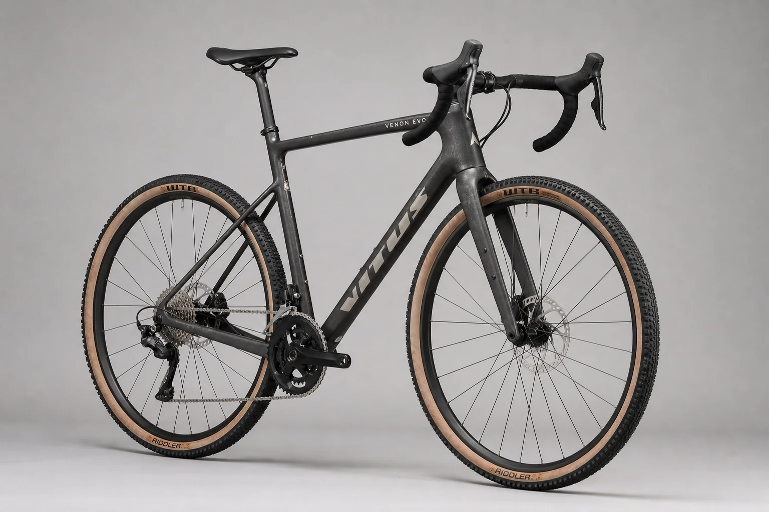 Multiple allroad bikes displayed on neutral backdrop showing different frame materials and designs