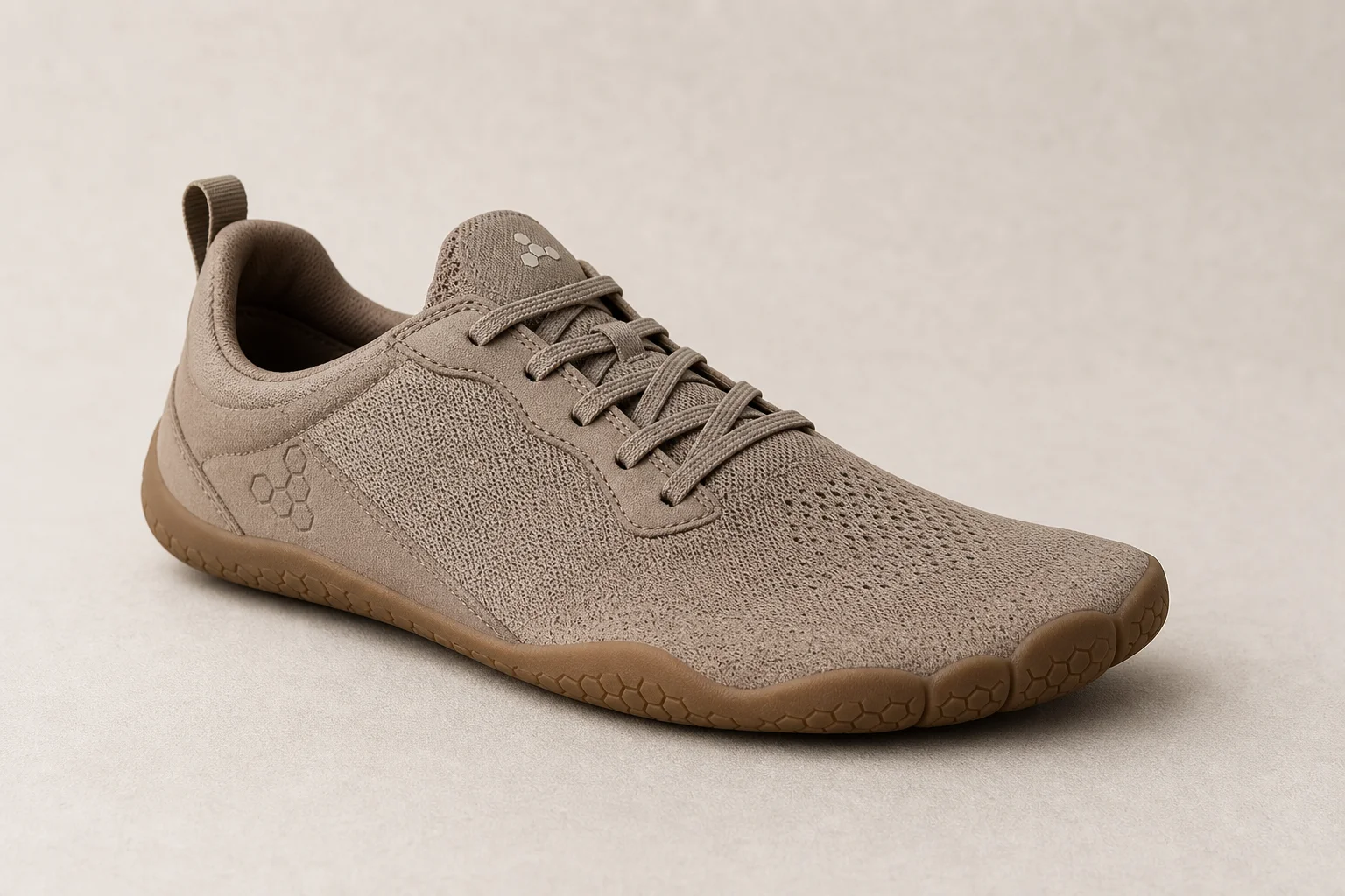 Collection of barefoot shoes from multiple brands displayed on neutral backdrop