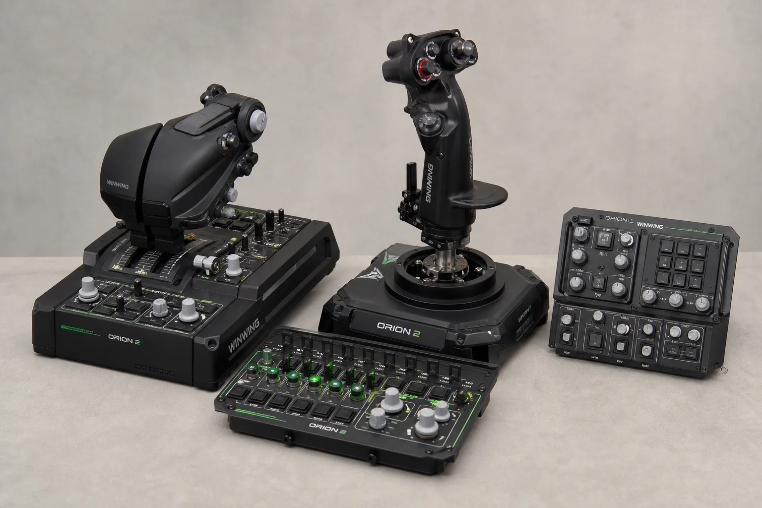 Three flight sim joysticks and throttles arranged by price tier on grey surface