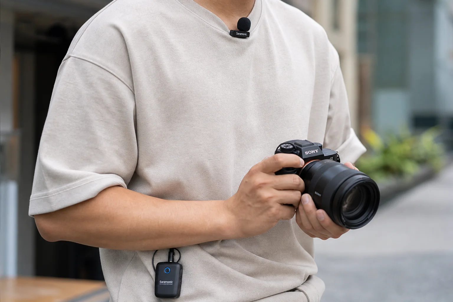Content creator outdoors with wireless lavalier microphone clipped to clothing