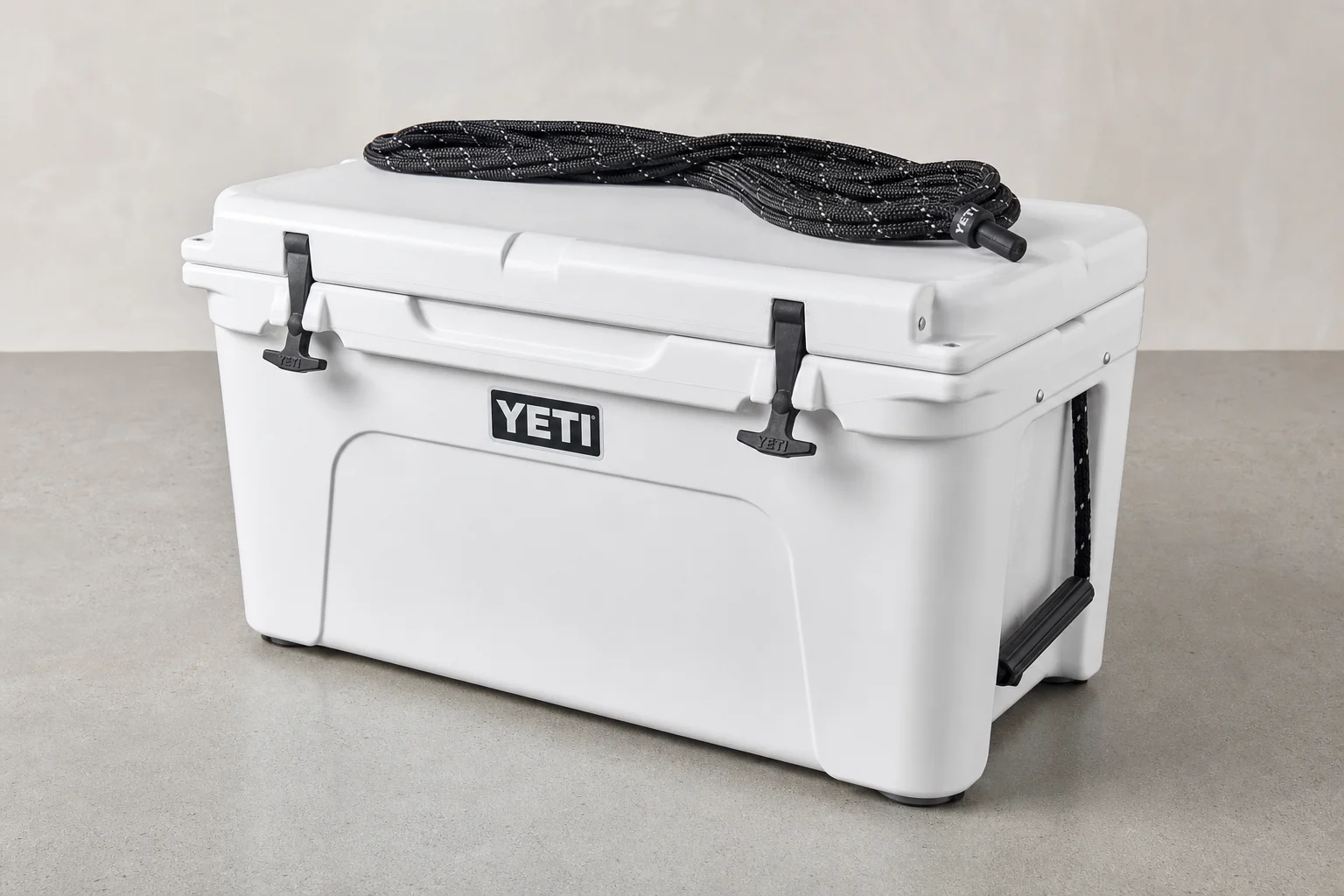 Five coolers arranged by size from smallest to largest on neutral backdrop