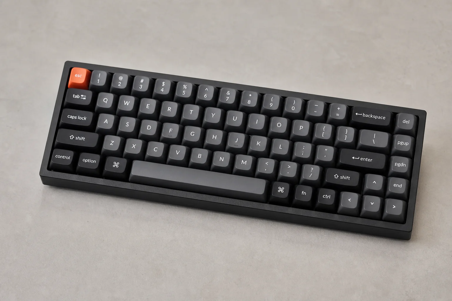 Eight budget and mid-range Hall Effect mechanical keyboards displayed on concrete surface