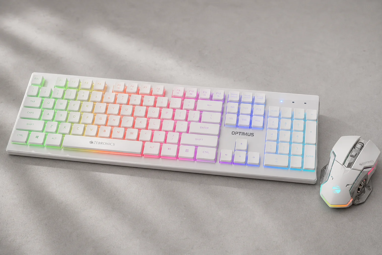 Eight gaming keyboard-mouse combos displayed on concrete surface showing various designs and colors
