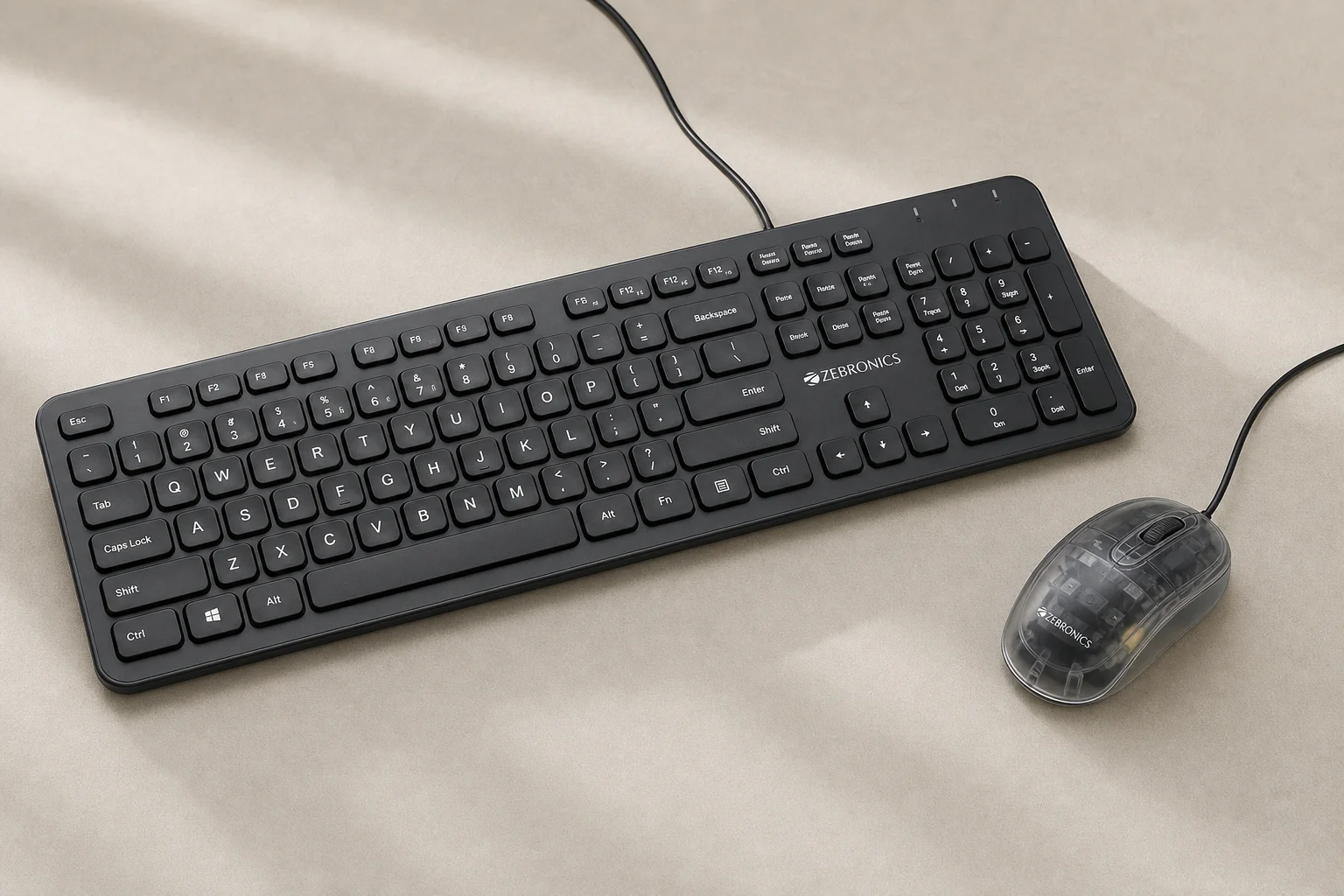 Eight gaming keyboard-mouse combos displayed on concrete surface showing various designs and colors