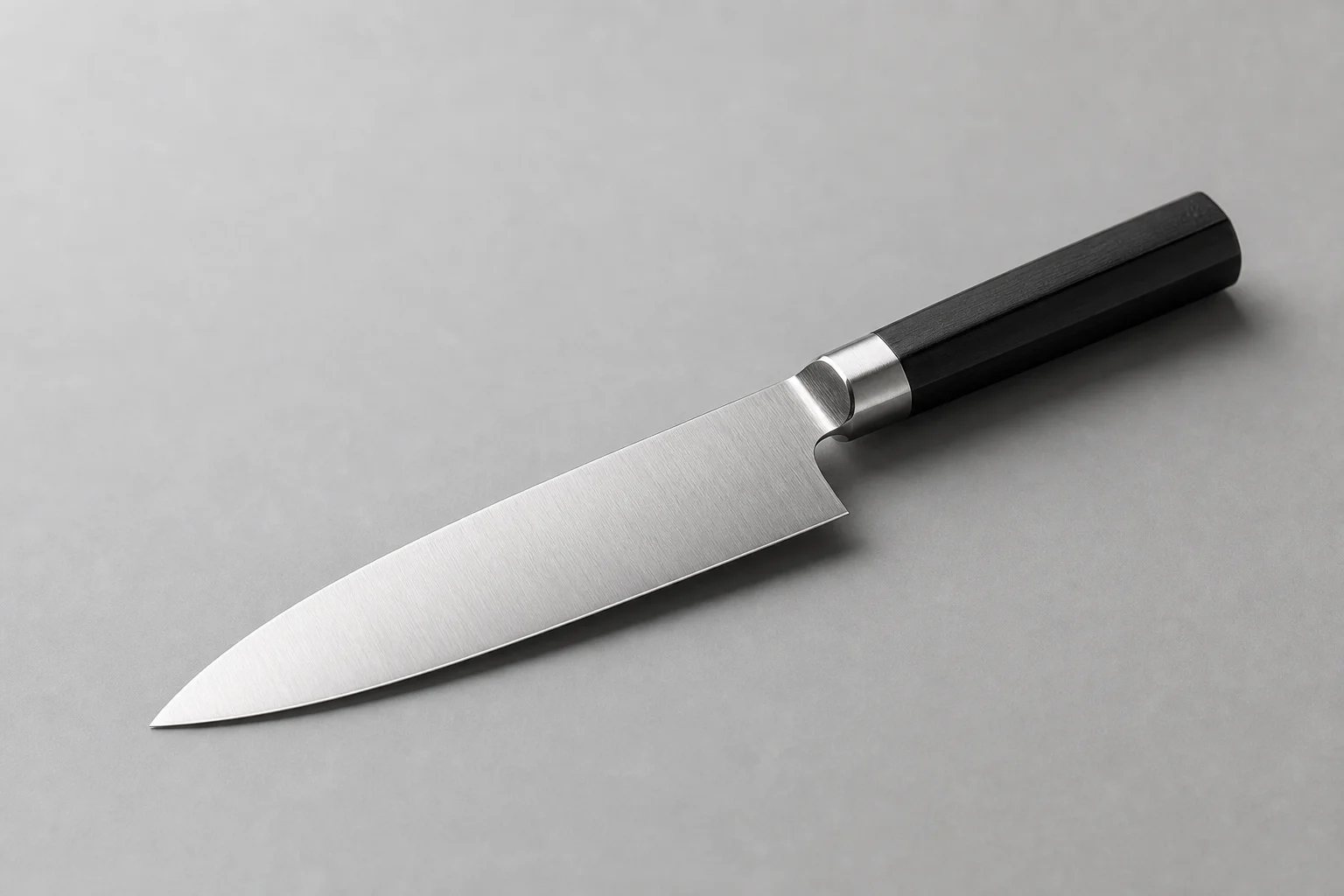 Five chef knives arranged in a row showing different handle styles and blade designs